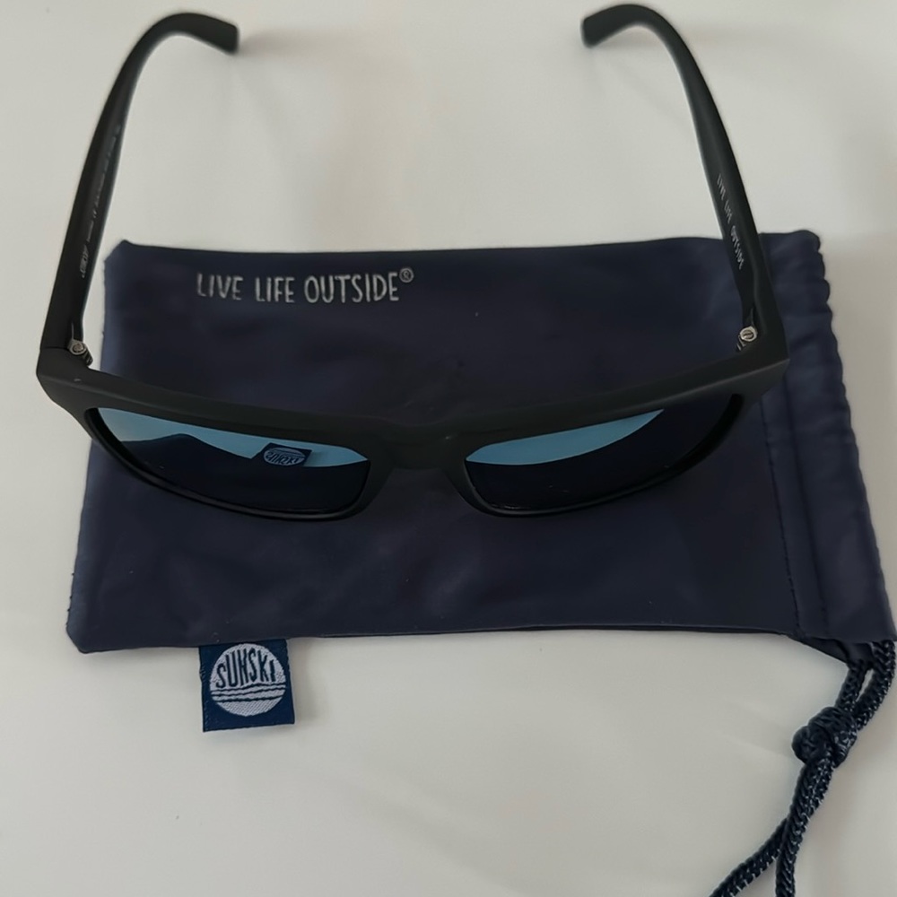 Sunski taravals. Black frame with blue mirror reflective polarized lens.
